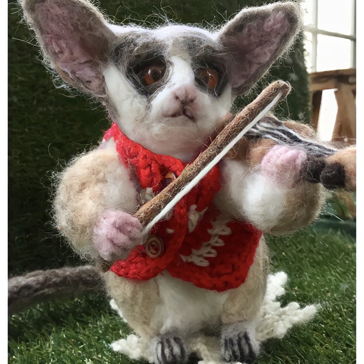 羊毛フェルトのショウガラゴのバイオリニスト